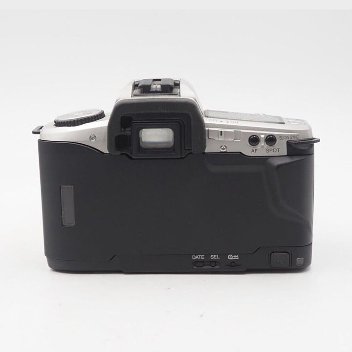 Rear view silver and black Minolta Maxxum 5 SLR film camera with textured grip and control buttons at ClubCamera.com