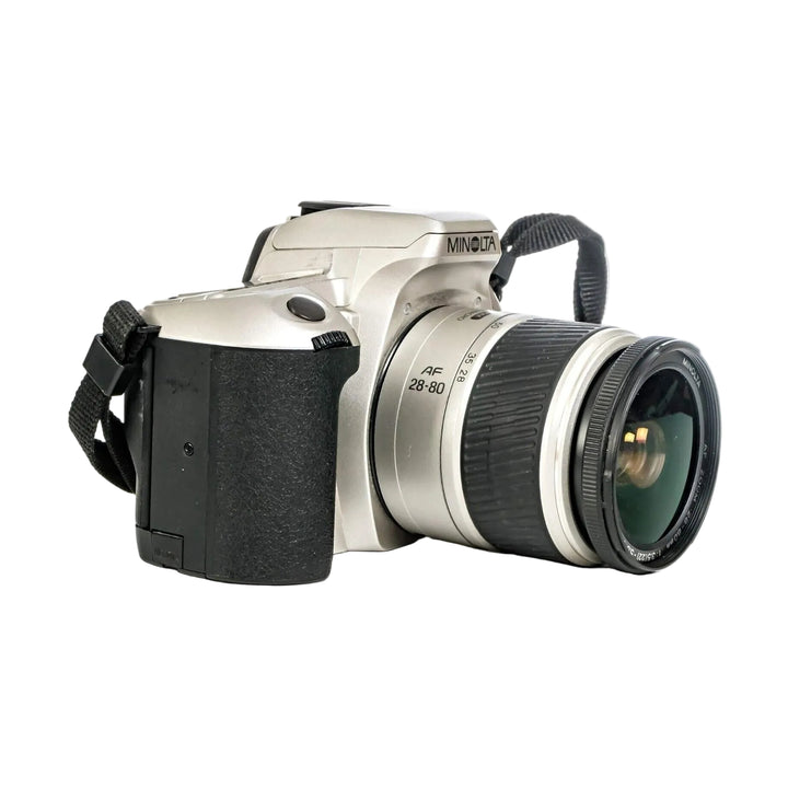 Silver Minolta Maxxum STsi SLR film camera with AF 28-80mm zoom lens and black grip at ClubCamera.com