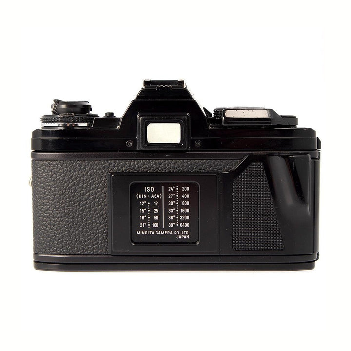 ClubCamera.com rear view of black Minolta X-700 SLR featuring ISO exposure guide plate and textured grip surface