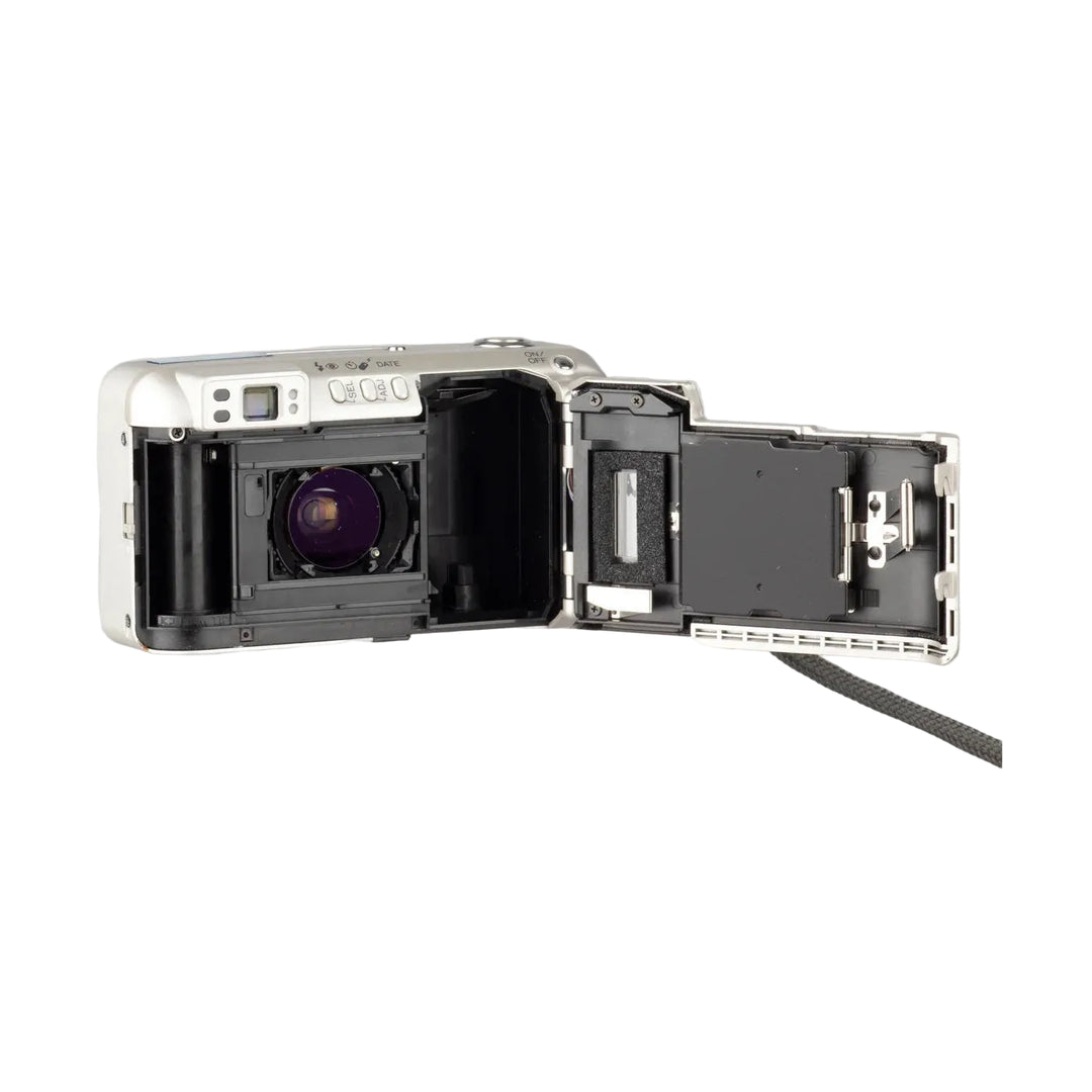 ClubCamera.com open film compartment of silver Minolta Freedom Zoom 140 revealing internal mechanics and date function