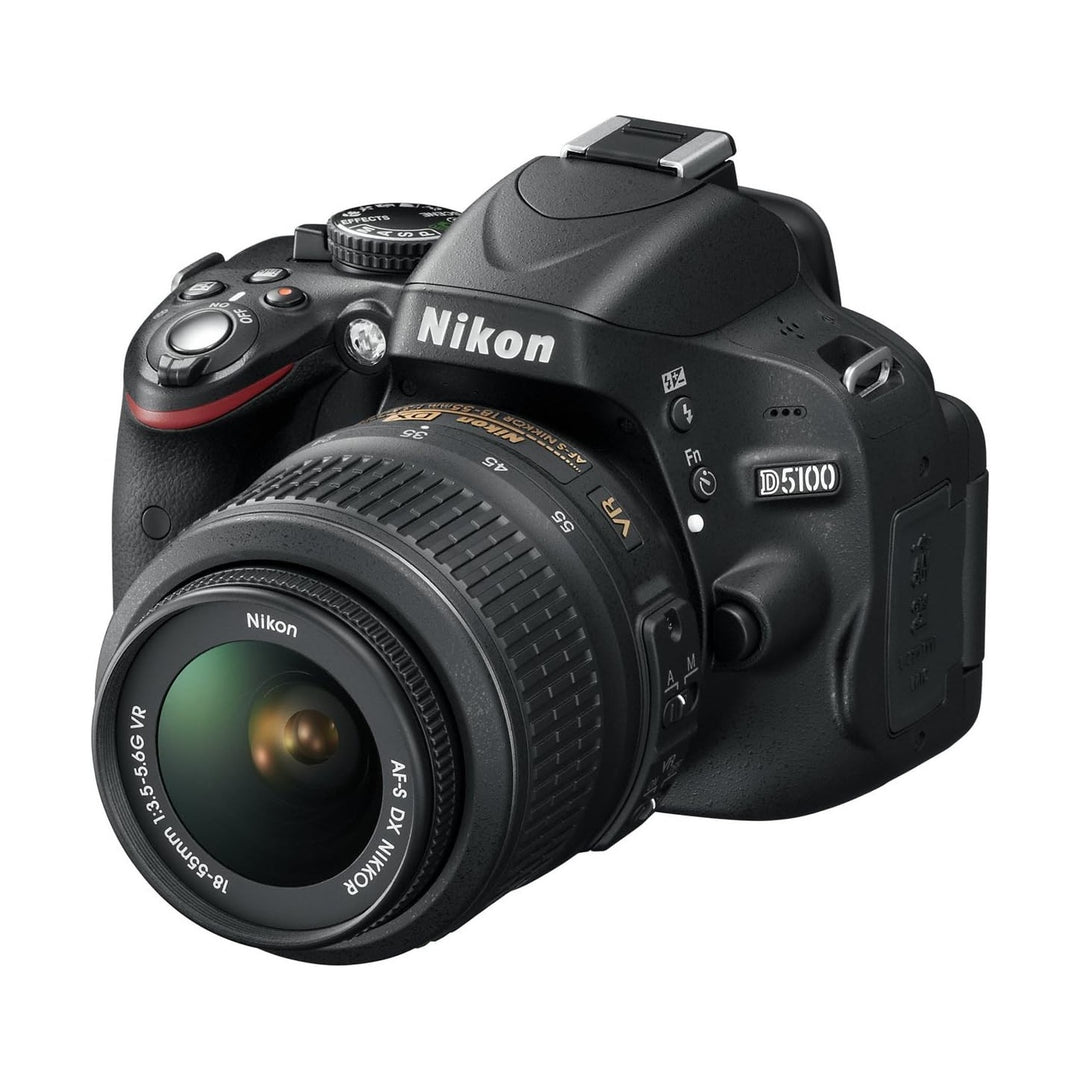 Black Nikon D5100 DSLR camera with AF-S DX NIKKOR 18-55mm lens at ClubCamera.com showing textured grip and red dial accent