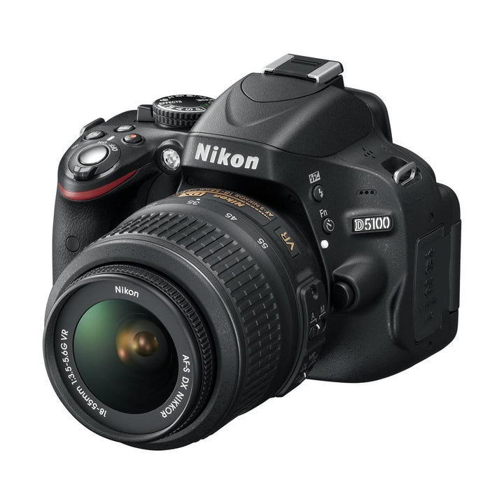 Black Nikon D5100 DSLR camera with AF-S DX NIKKOR 18-55mm lens at ClubCamera.com showing textured grip and red dial accent