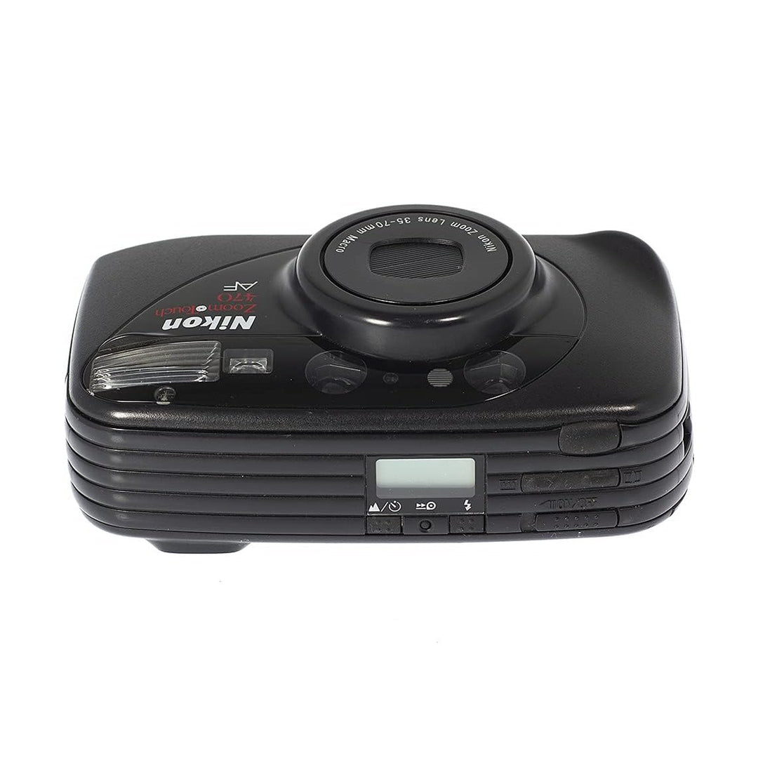 Top view of black Nikon ZoomTouch 470 AF point-and-shoot showing shutter button, LCD screen, and control buttons from ClubCamera.com