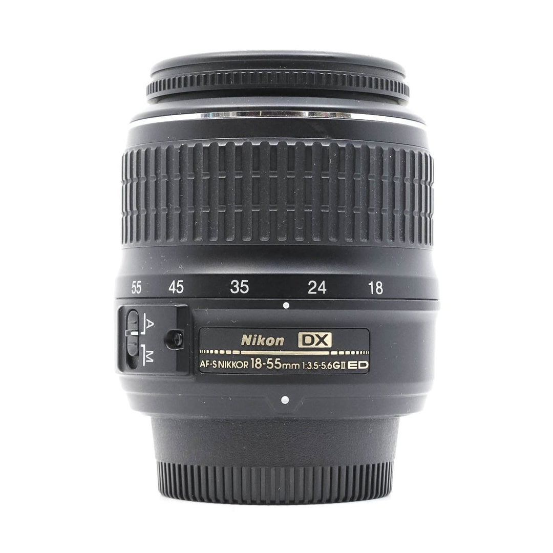Nikon AF-S DX NIKKOR 18-55mm f/3.5-5.6G ED II lens front view with gold label at ClubCamera.com