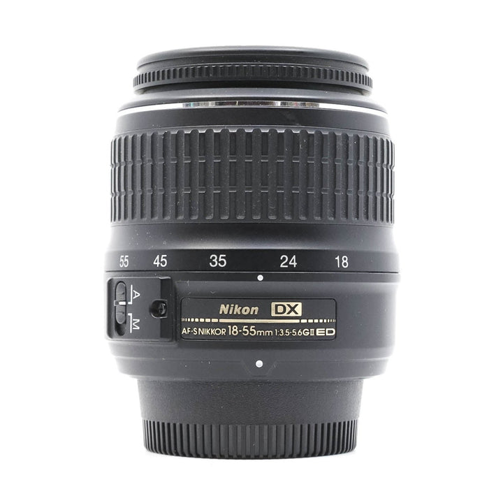 Nikon AF-S DX NIKKOR 18-55mm f/3.5-5.6G ED II lens front view with gold label at ClubCamera.com