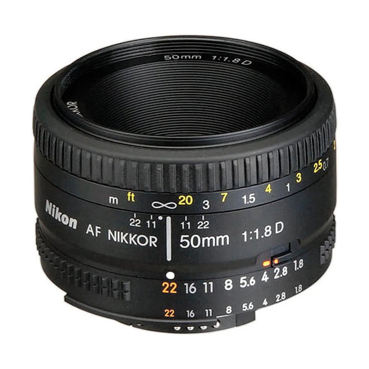 Nikon AF NIKKOR 50mm f/1.8D lens side angle showing orange aperture scale and focus ring at ClubCamera.com