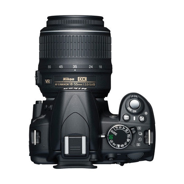 Top-down view of black Nikon D3100 DSLR showing mode dial icons and hot shoe, ClubCamera.com