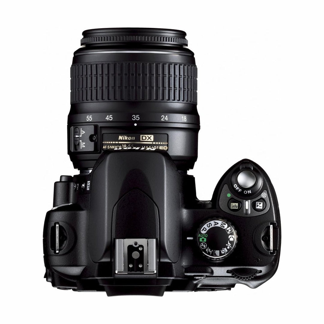 Top-down view of Nikon D40x mode dial and power switch with 18-55mm lens at ClubCamera.com