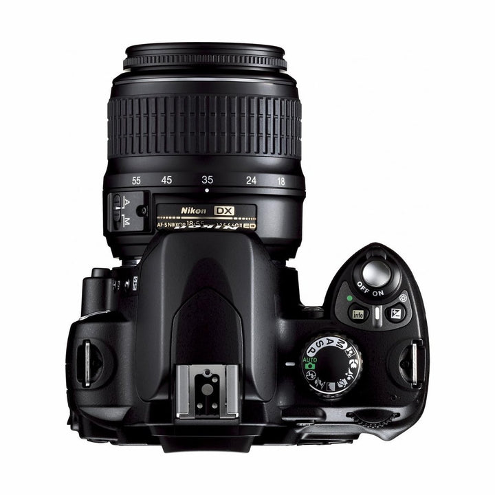 Top-down view of Nikon D40x mode dial and power switch with 18-55mm lens at ClubCamera.com