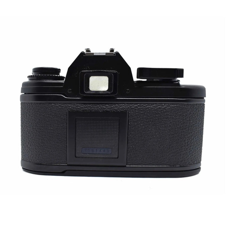Back view of black Nikon EM SLR film camera with rewind crank and serial number from ClubCamera.com