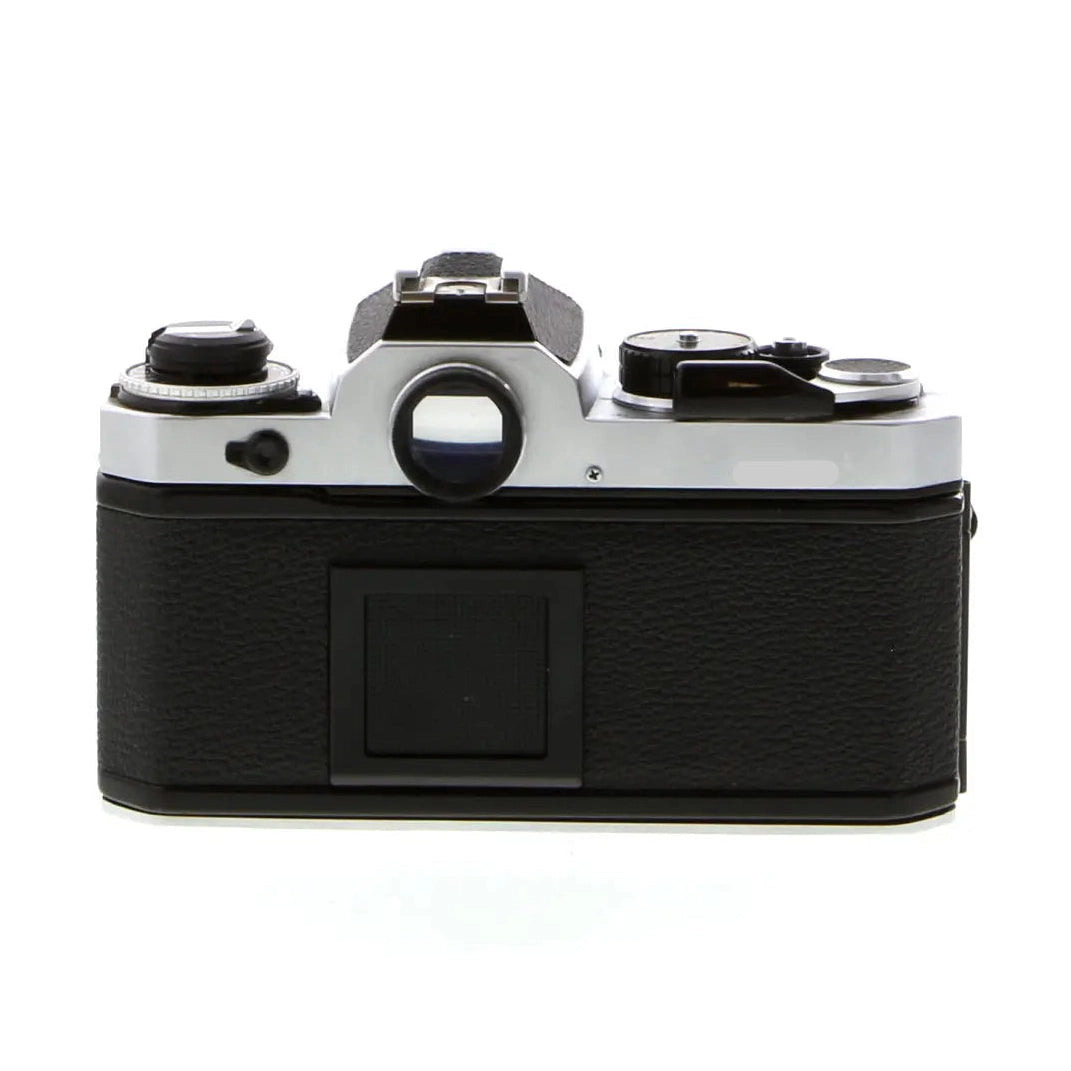 Top view Nikon FE SLR camera body by ClubCamera showing silver top plate dials and black textured back panel