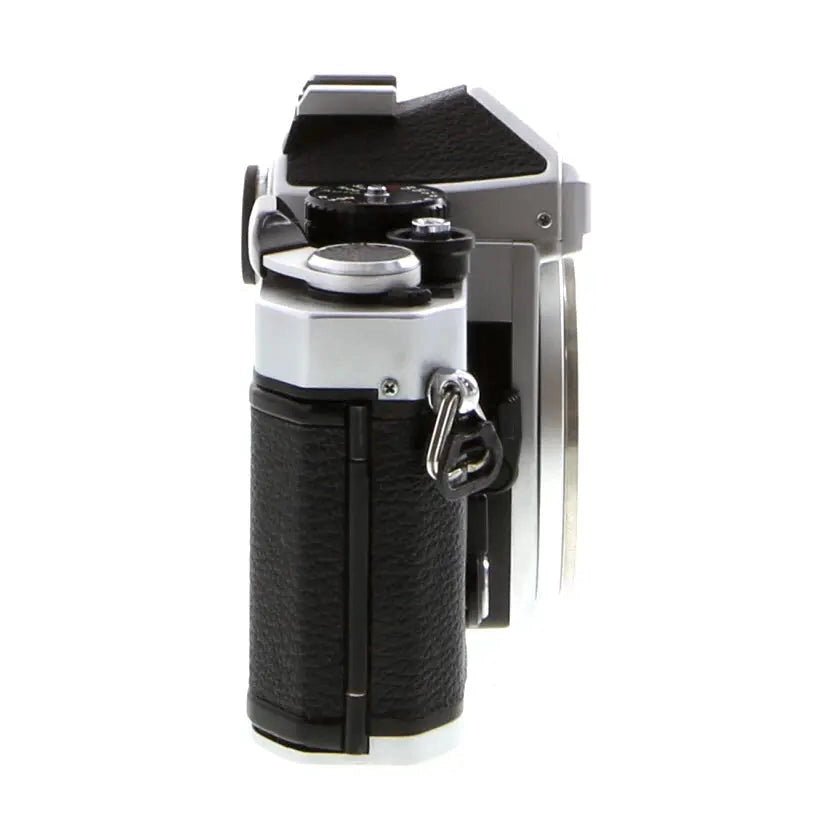 Right angle Nikon FE manual focus SLR body by ClubCamera highlighting shutter speed dial and ergonomic handgrip