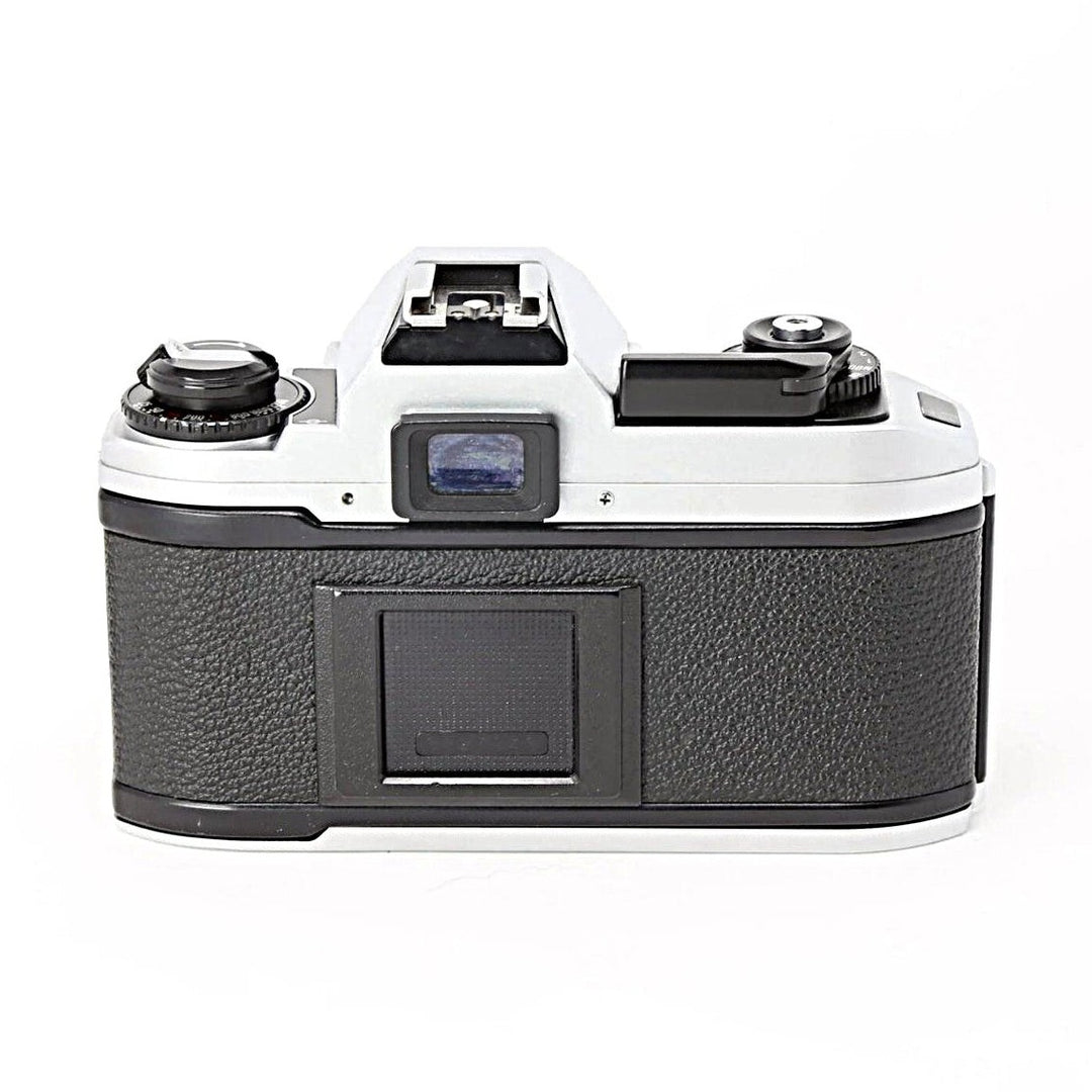 Back view of Nikon FG-20 35mm SLR film camera with optical viewfinder and hot shoe mount by ClubCamera.com