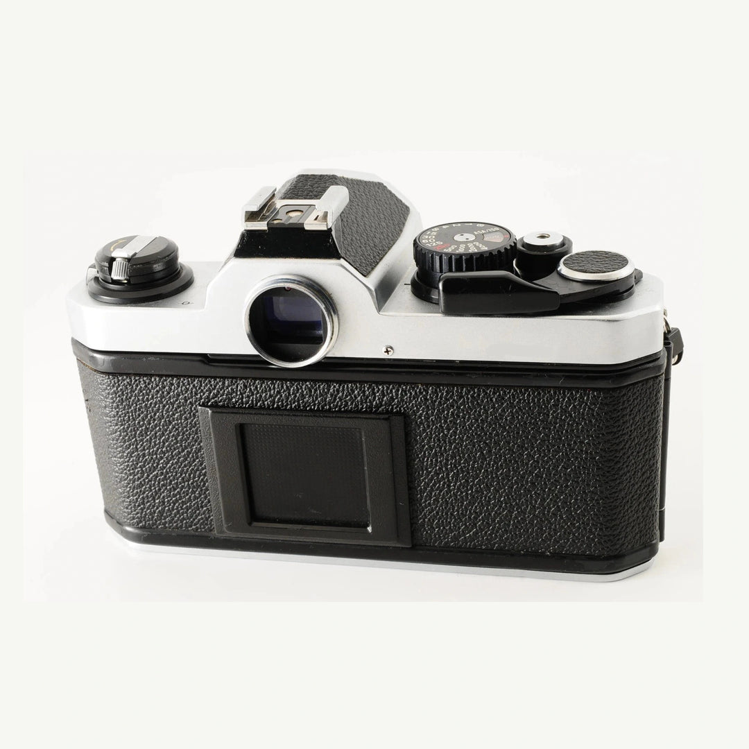 Rear view of Nikon FM2 mechanical SLR film camera showing rewind knob and exposure metering dial at ClubCamera.com