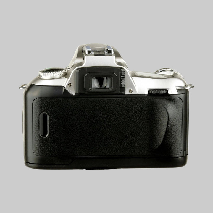 Rear view of silver Nikon N55 SLR film camera with textured pebbled grip, viewfinder eyepiece, and hot shoe at ClubCamera.com