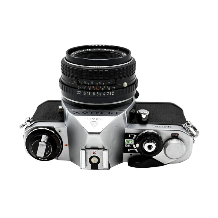 Pentax ME film camera bottom-up view of hot shoe mount and AUTO mode selector dial with 50mm lens at ClubCamera.com