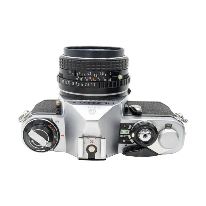 ClubCamera.com top-down view of silver Pentax ME SLR with SMC Pentax-M 50mm f/1.7 lens showing mode dial and exposure controls