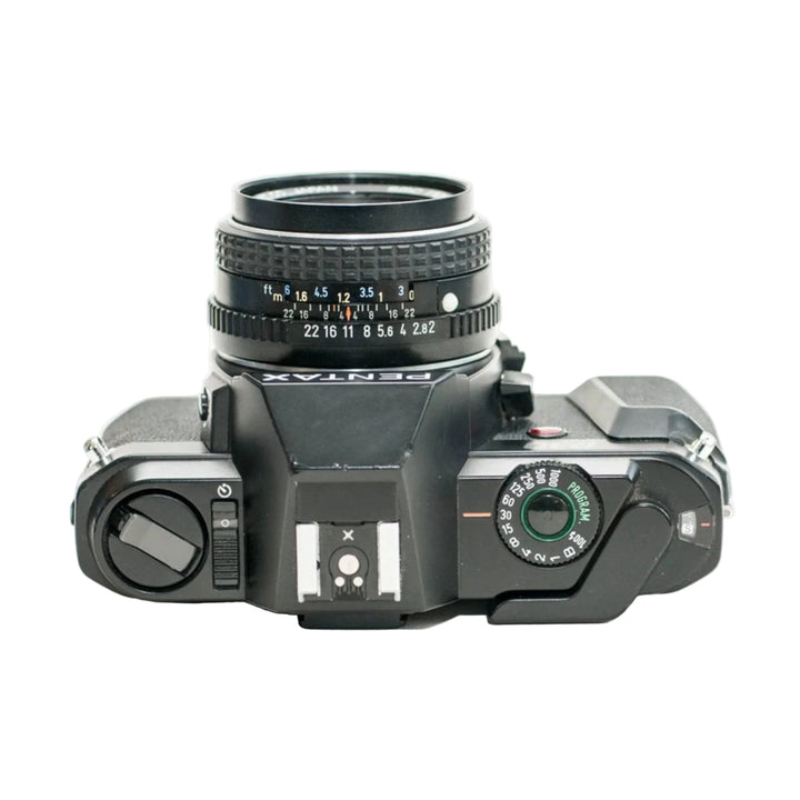 Top-down view of black Pentax P30 camera with shutter speed dial and aperture ring at ClubCamera.com