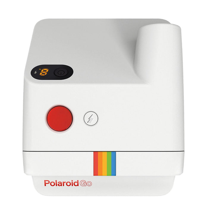 Close-up of white Polaroid Go instant camera controls featuring red shutter button and rainbow logo