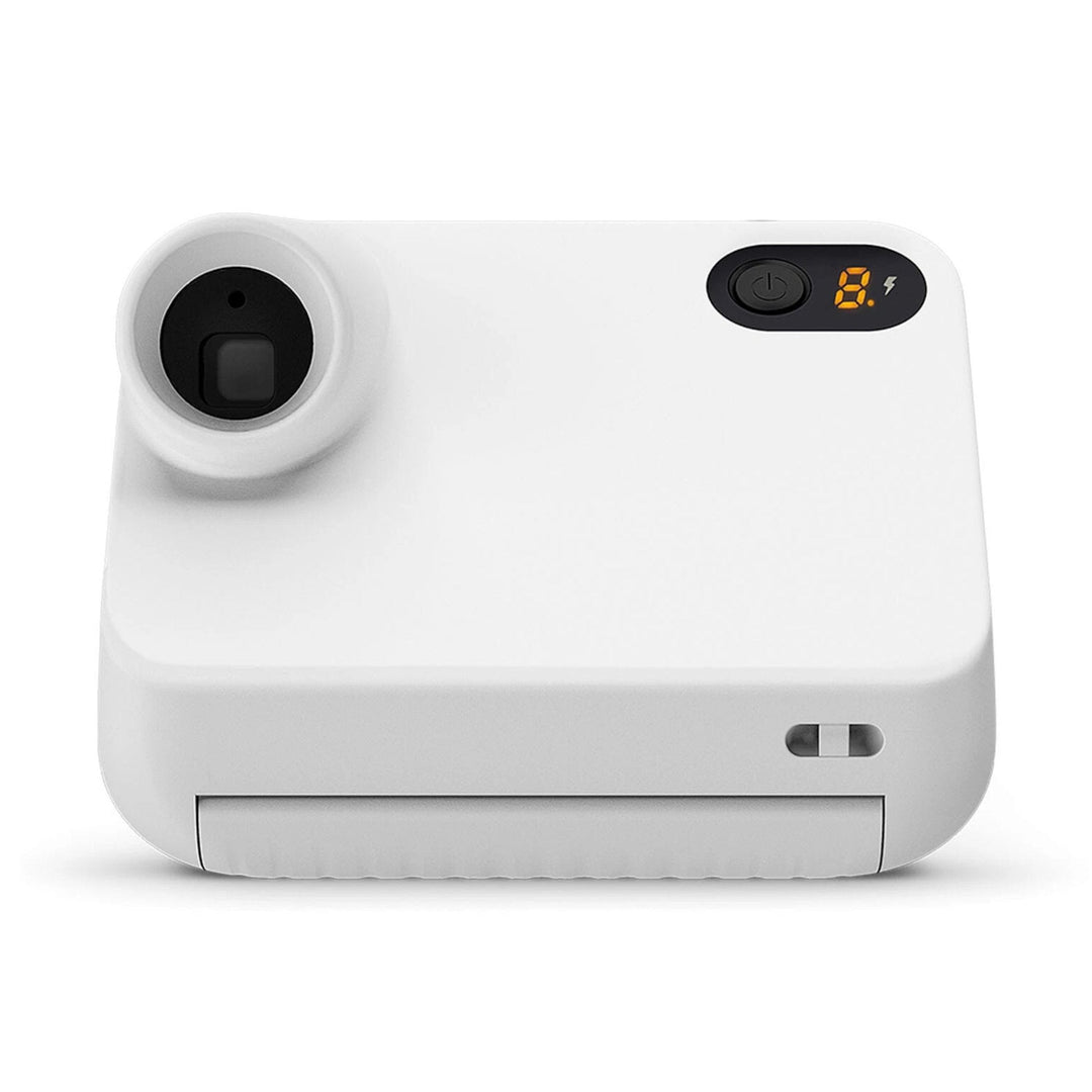Top-down view of white Polaroid Go camera showing orange LED battery display and power button