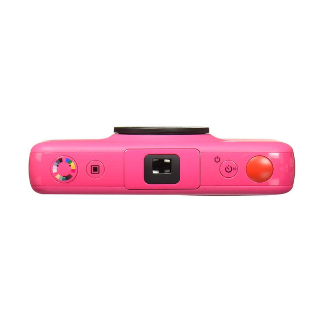 ClubCamera.com top-down view of pink Polaroid Snap printer showing color mode dial, microSD slot, and burst mode shutter button controls