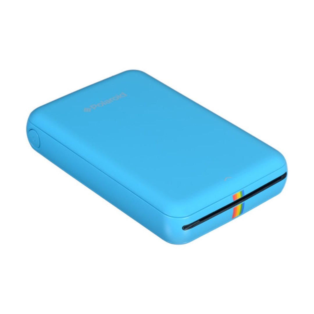 Bright blue Polaroid Zip digital photo printer showing black output slot and rainbow ZINK logo for 2x3 prints at ClubCamera.com