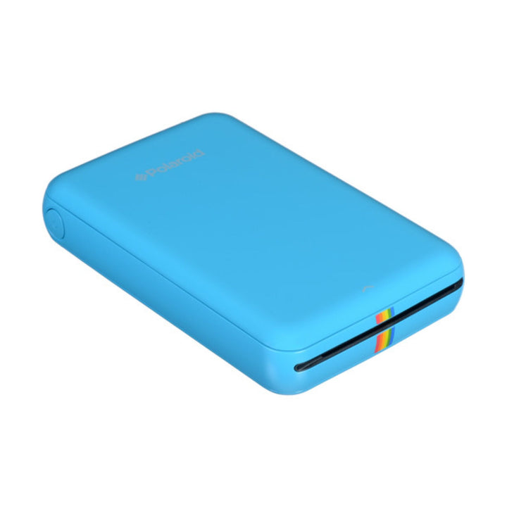 Bright blue Polaroid Zip digital photo printer showing black output slot and rainbow ZINK logo for 2x3 prints at ClubCamera.com