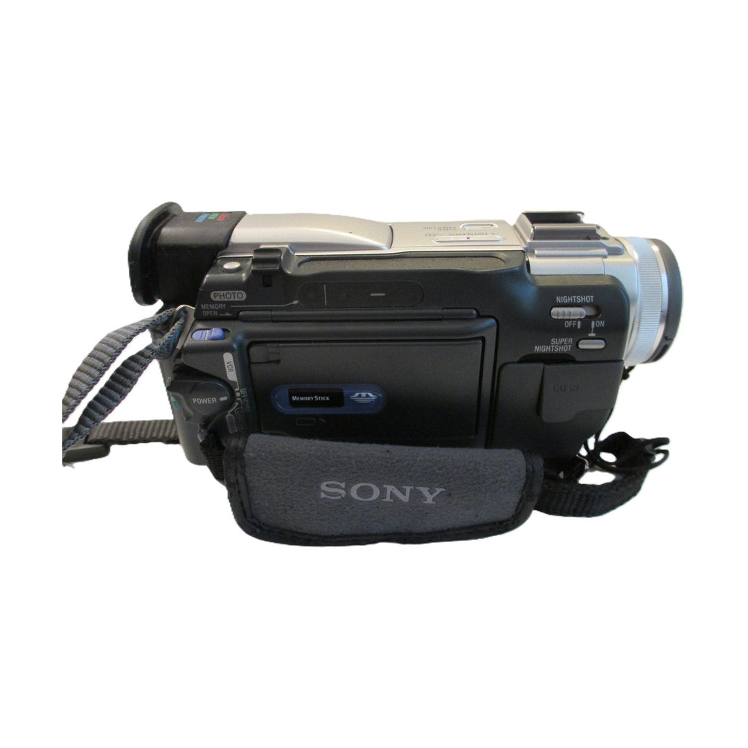 ClubCamera.com Sony DCR-TRV11 camcorder on carrying case showing Memory Stick slot and NightShot switch