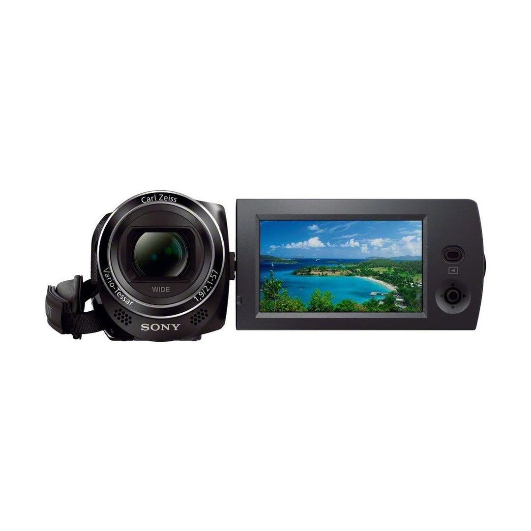 Sony HDR-CX230/B black camcorder with flip-out LCD showing beach scene at ClubCamera.com