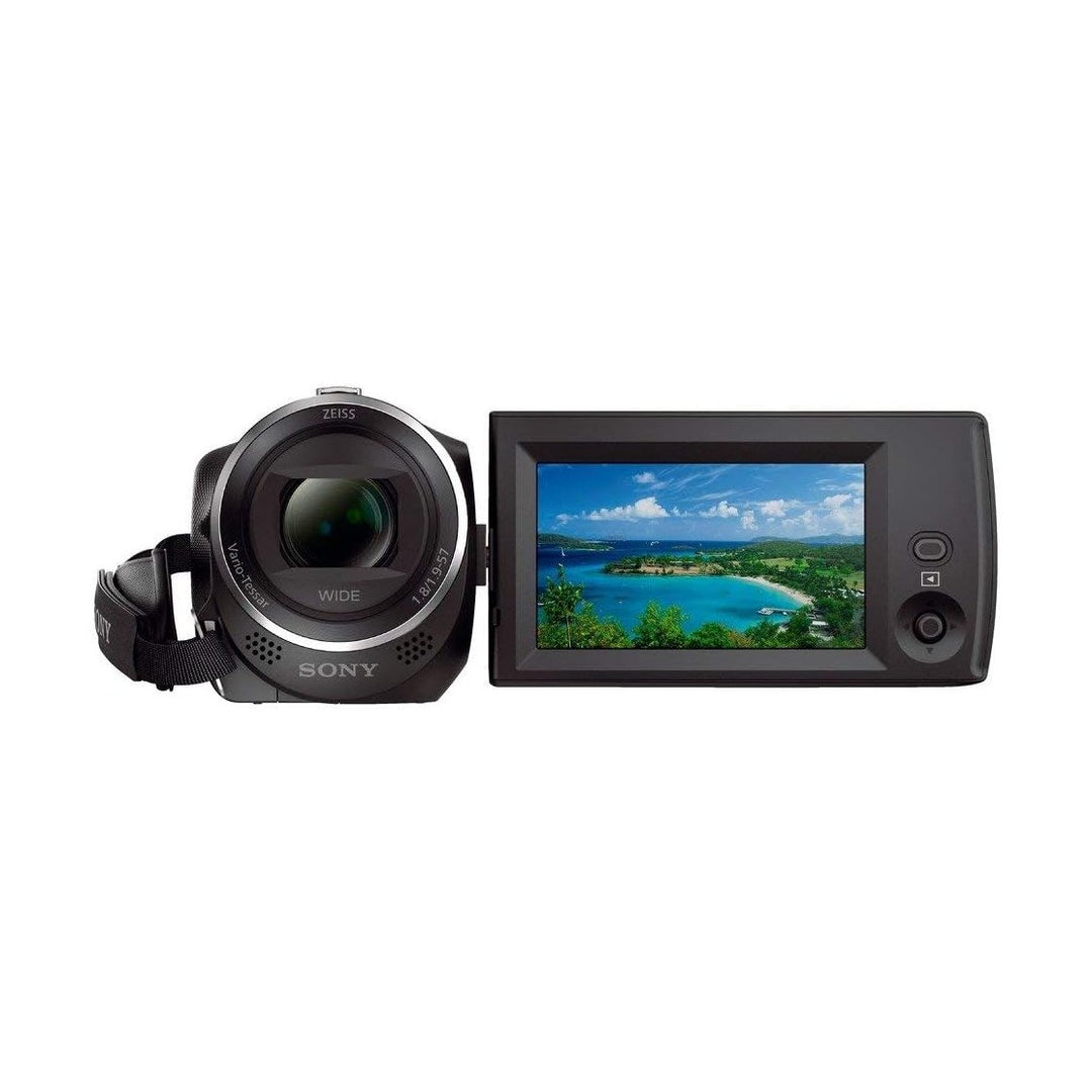 Sony HDR-CX405 Handycam front view with flip-out LCD screen showing beach scene at ClubCamera.com