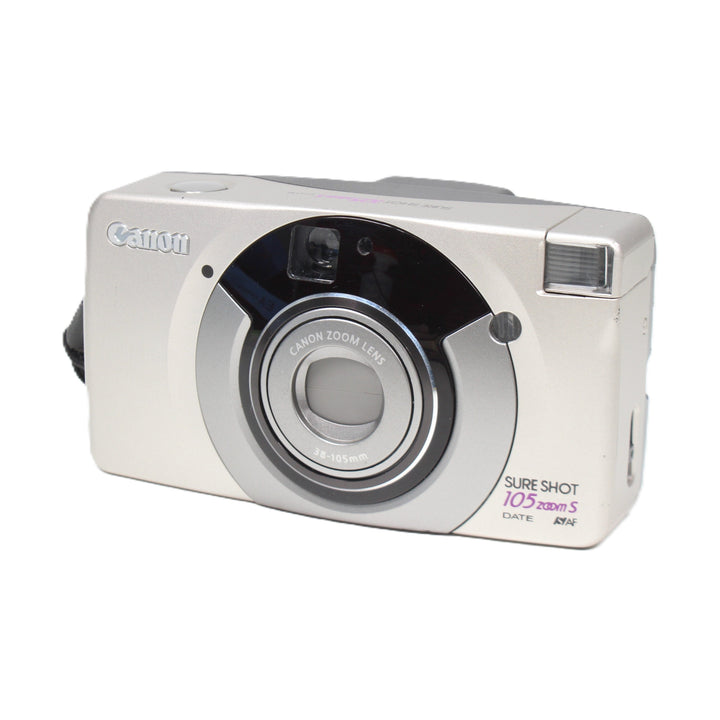 ClubCamera three-quarter angle of silver Canon Sure Shot 105 Zoom S highlighting lens rings and brushed finish