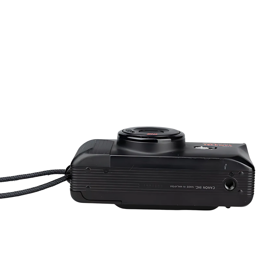 Rear three-quarter view of Canon TELEMAX with lens cap and MADE IN MALAYSIA text at ClubCamera.com