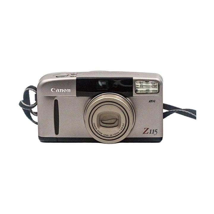 Frontal silver Canon Sure Shot Z115 35mm point and shoot film camera with retracted zoom lens and braided strap sold by ClubCamera.com
