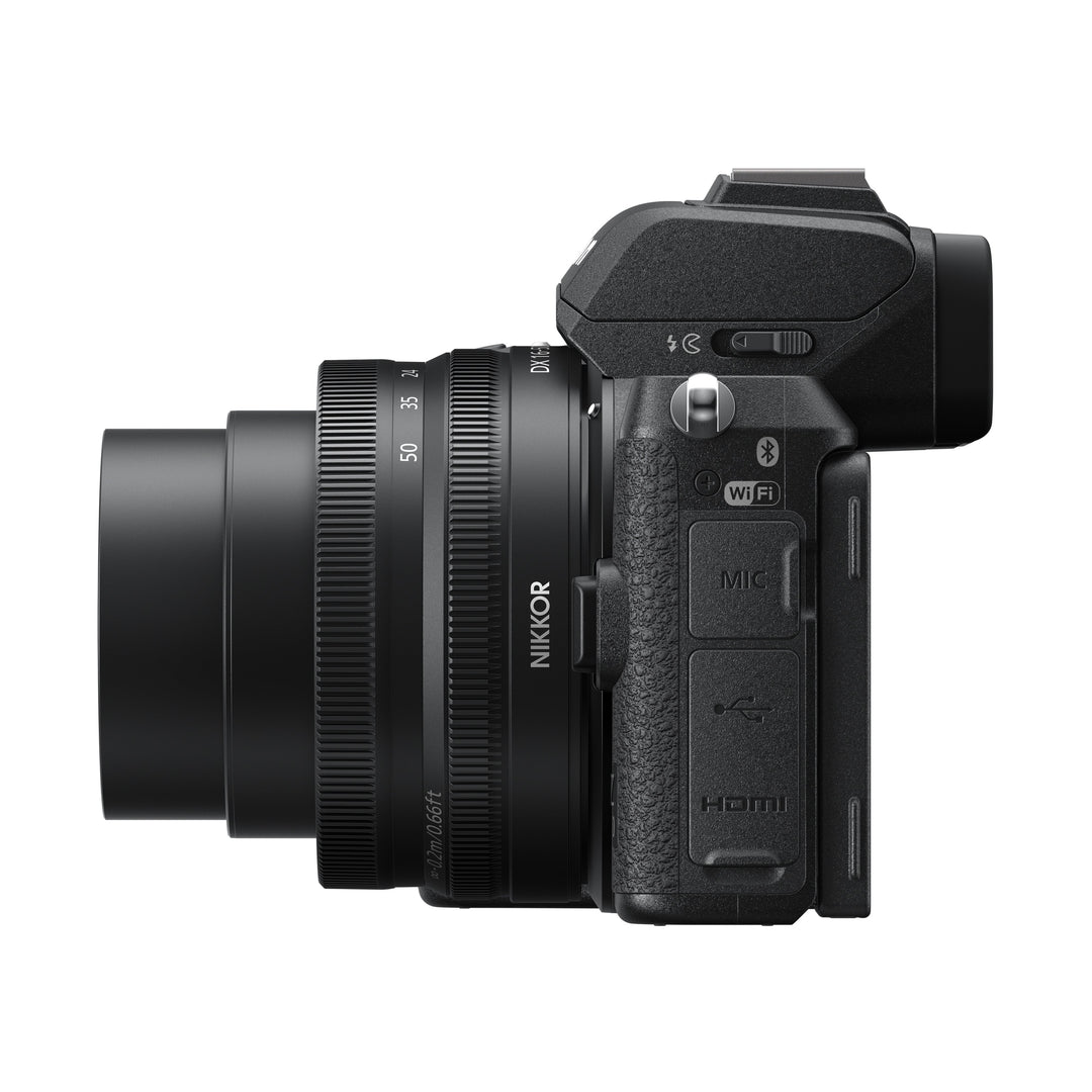 ClubCamera.com black Nikon Z50 mirrorless camera side profile with NIKKOR Z DX 16-50mm VR lens ports and textured grip