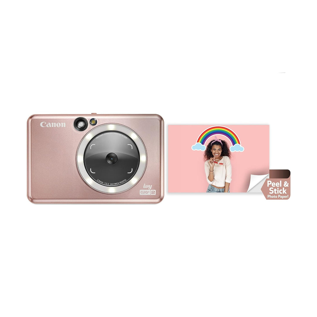 Rose gold Canon IVY CLIQ+2 instant camera with LED ring light and peel-and-stick photo print at ClubCamera.com