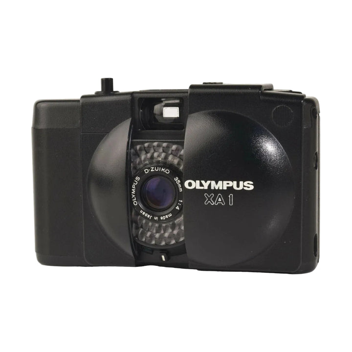 Front shot of black Olympus XA1 35mm film camera revealing D-Zuiko lens and white branding by ClubCamera.com