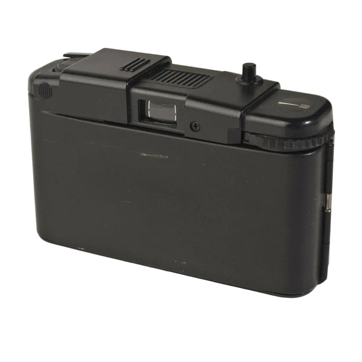 Rear view of black Olympus XA1 point-and-shoot film camera with matte plastic body and textured grip at ClubCamera.com