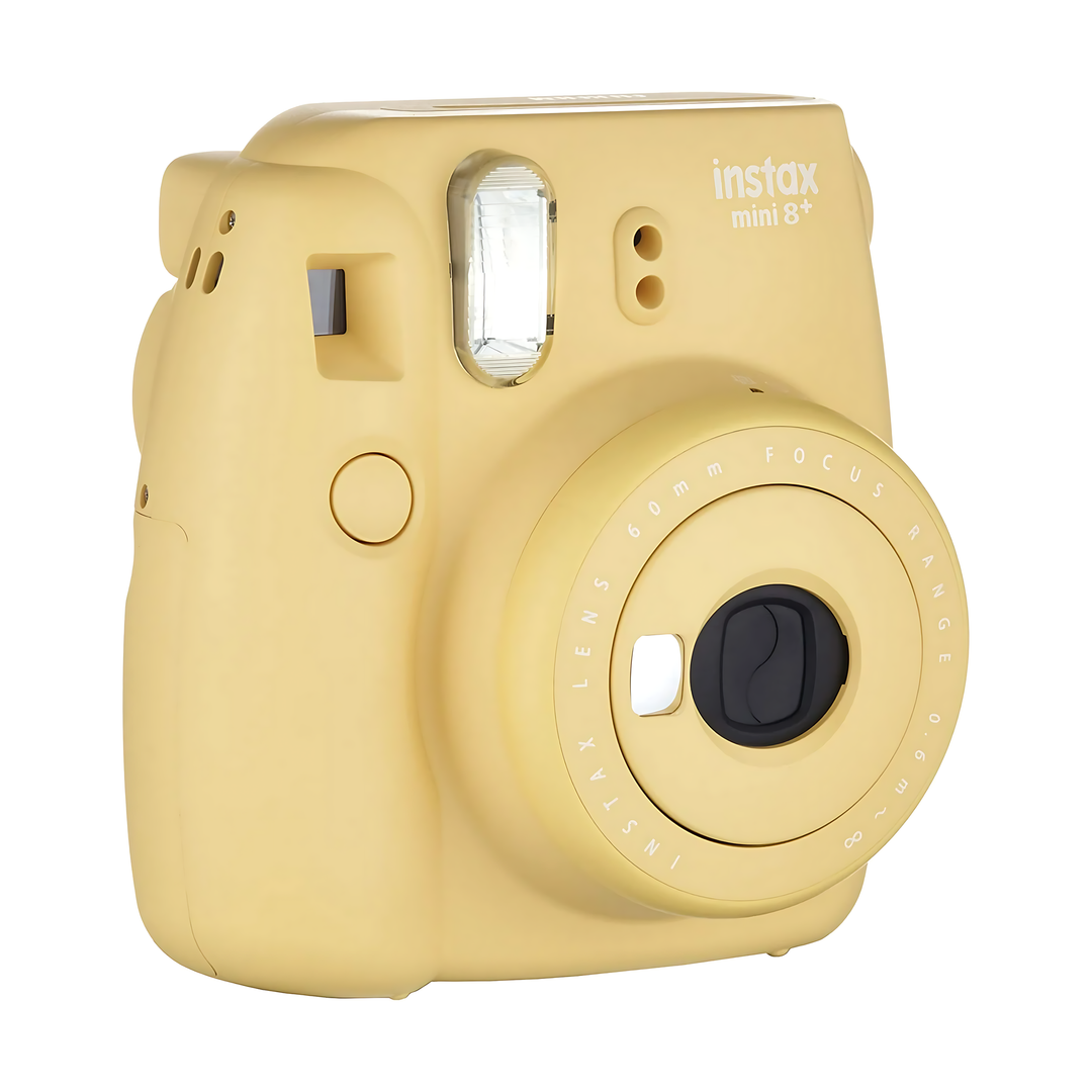 Angled shot of ClubCamera.com Fujifilm Instax Mini 8+ Honey camera revealing 60mm lens markings and top controls