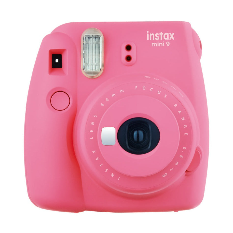Front view of Fujifilm Instax Mini 9 in Flamingo Pink from ClubCamera.com highlighting symmetrical lens assembly and ribbed flash cover