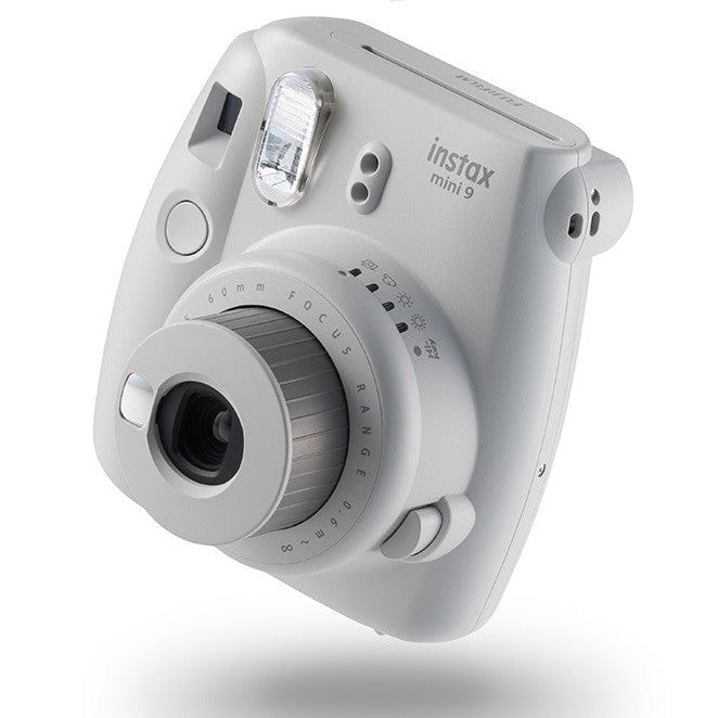 Side view of Fujifilm Instax Mini 9 Smoky White showing focus ring dials and ergonomic grip from ClubCamera.com
