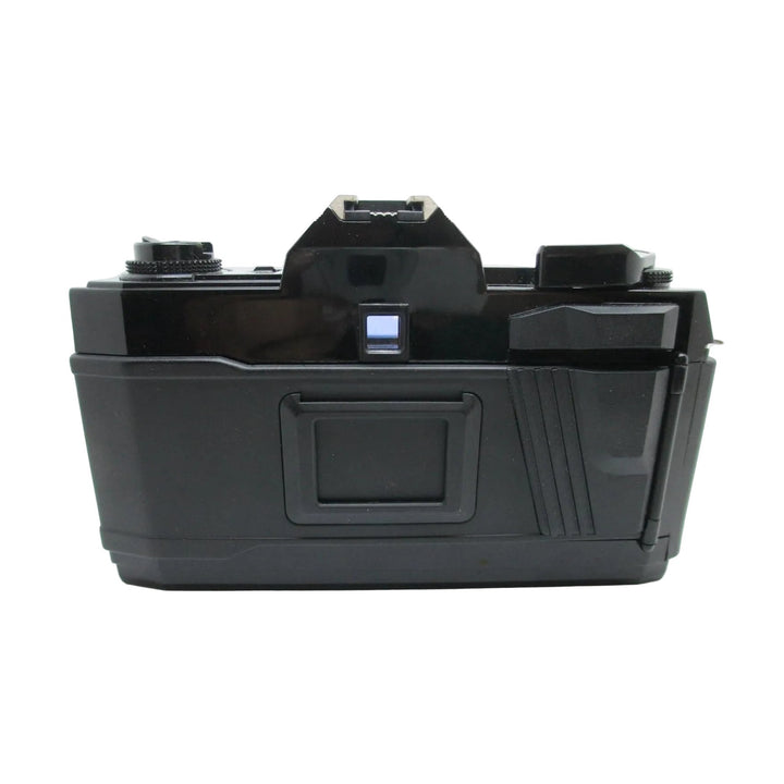 Rear view of vintage black Nishika N8000 3D film camera with matte finish and hinged film door at ClubCamera.com