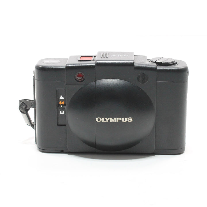 Black Olympus XA2 point-and-shoot film camera rear view with matte finish and wrist strap at ClubCamera.com