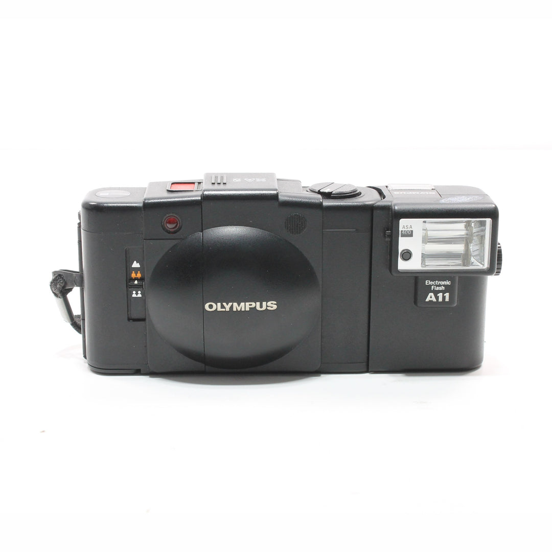 Black Olympus XA2 film camera with mounted Electronic Flash A11 unit on hot shoe at ClubCamera.com