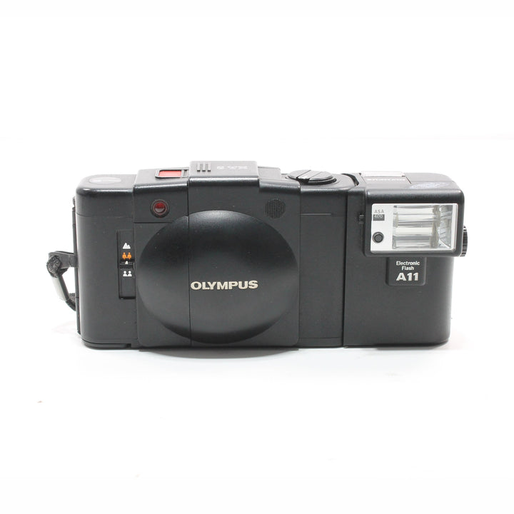 Black Olympus XA2 film camera with mounted Electronic Flash A11 unit on hot shoe at ClubCamera.com