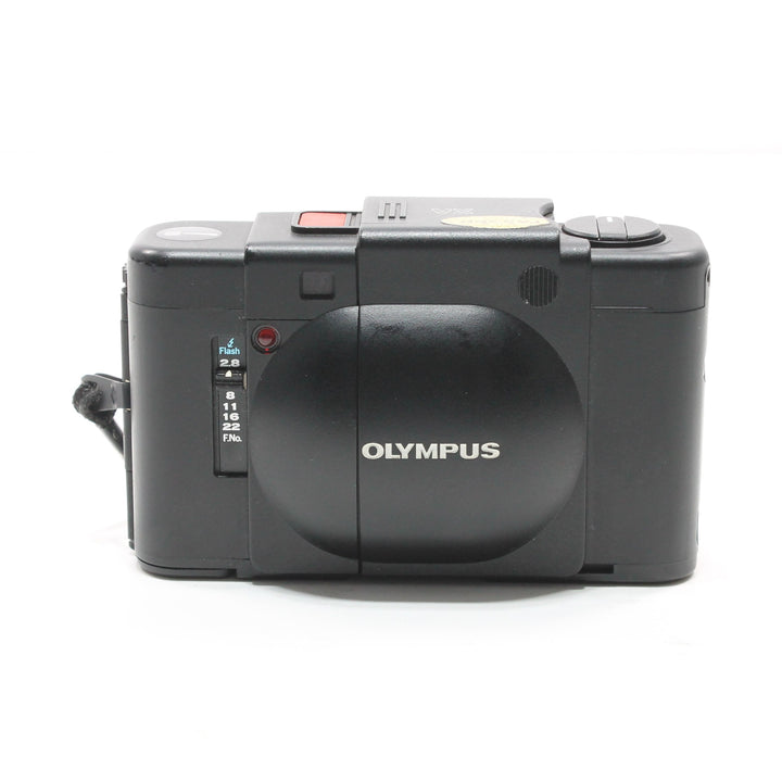 Black Olympus XA rear view with flash sync dial and silver logo at ClubCamera.com