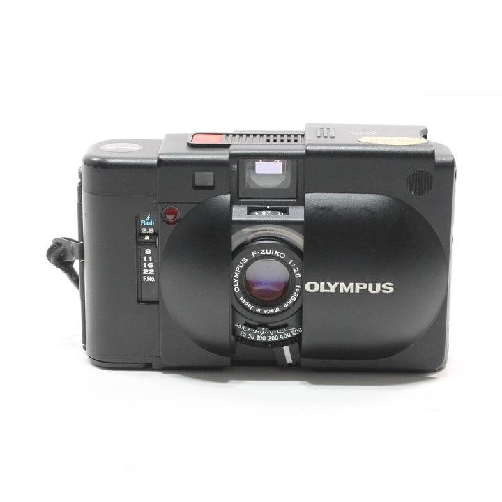 Front of black Olympus XA 35mm film camera with F-ZUIKO lens at ClubCamera.com