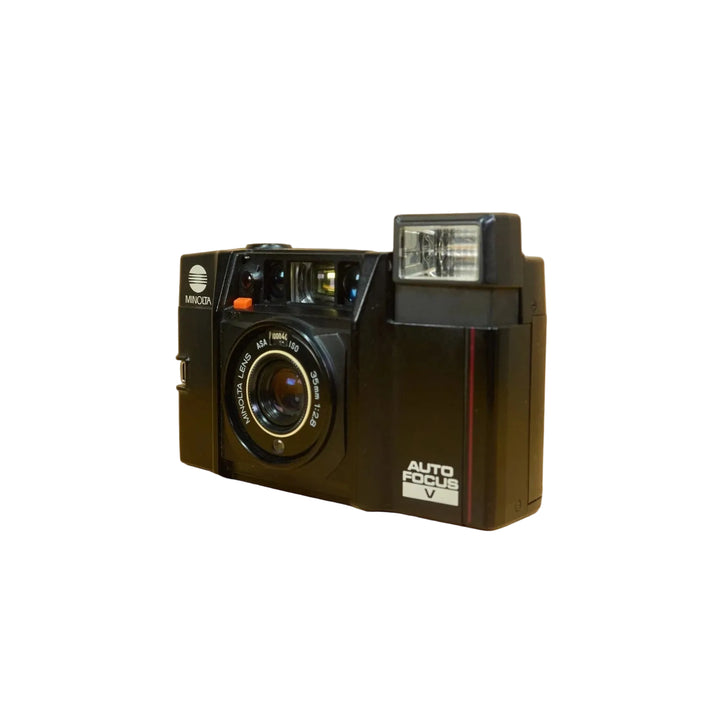 Black Minolta AF-Sv Talker 35mm film camera with gold-rimmed lens and red stripe by ClubCamera.com
