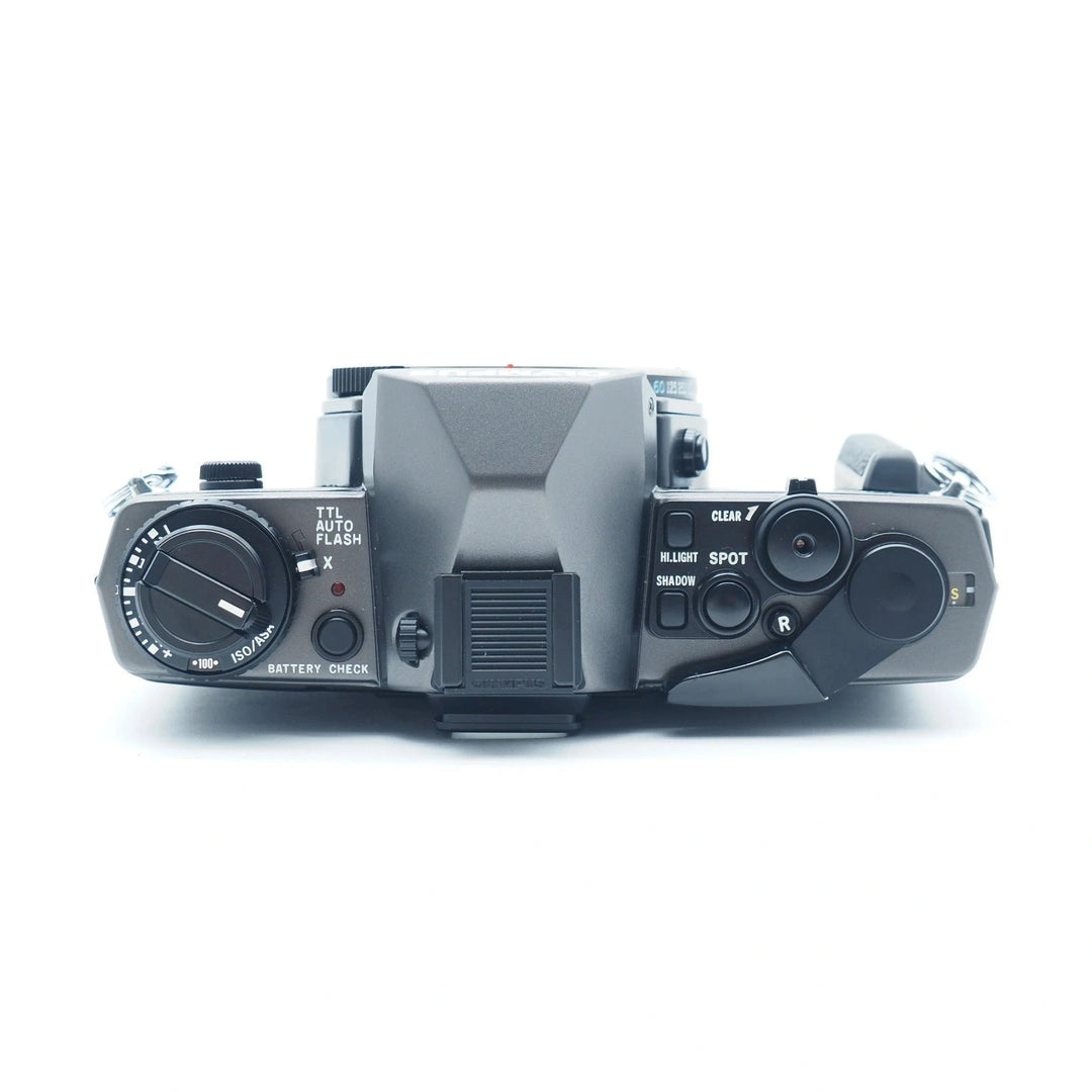 Olympus OM-3ti manual SLR film camera top view with ISO dial and spot metering buttons at ClubCamera.com