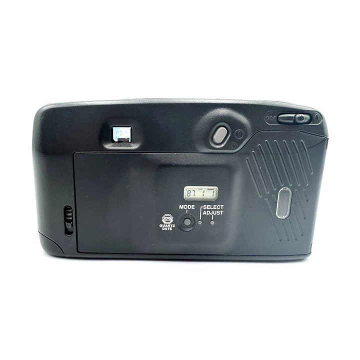 Rear view of black Pentax IQZoom 60X 35mm camera displaying Quartz Date digital display, control dial, and battery cover from ClubCamera.com