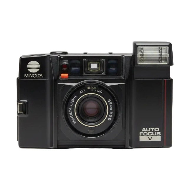 Front shot of vintage black Minolta AF-Sv 35mm point-and-shoot with f/2.8 lens and orange shutter button at ClubCamera.com